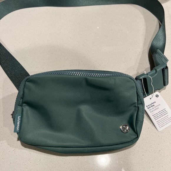lululemon athletica Handbags - NWT Lululemon Everywhere Belt Bag in color Tidewater Teal